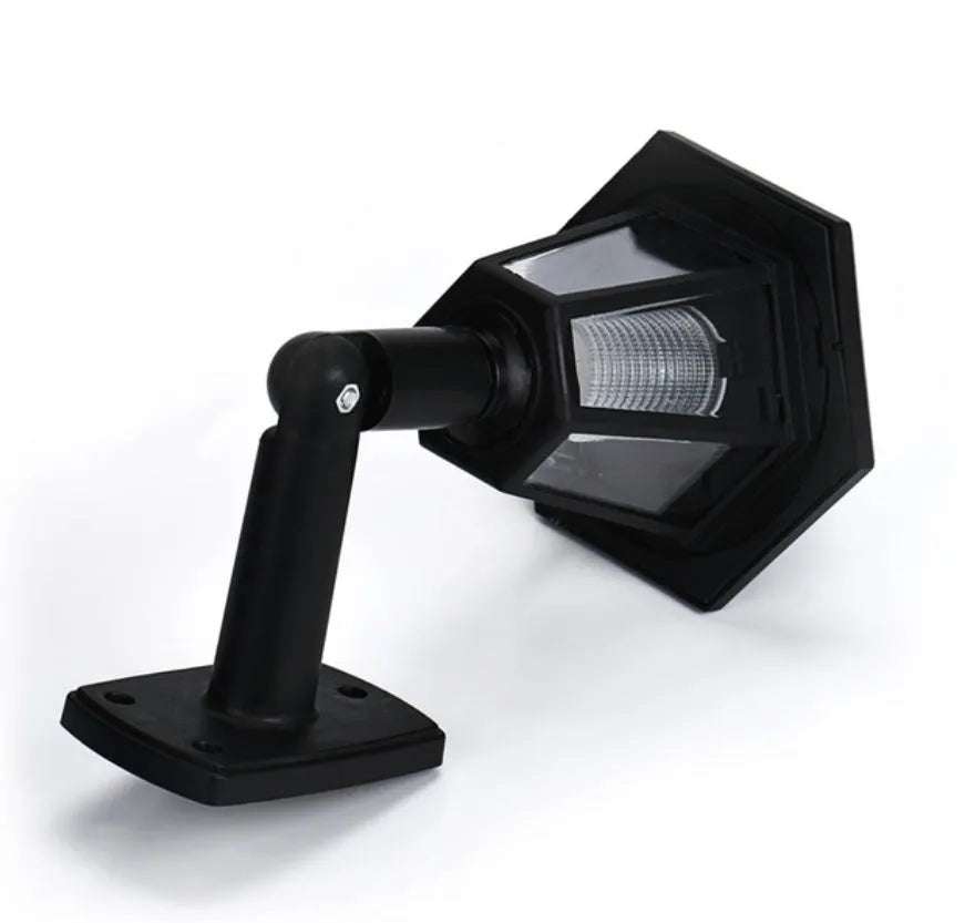Black hexagonal solar wall lamp with solar panel, measuring 13x15x22cm