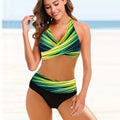 Ladies striped tie-dye bikini set with hollow details and high-waisted briefs on a model.