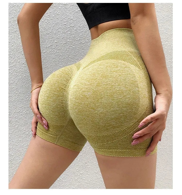 Women's high-waist yoga shorts in various colours with seamless waist design for fitness activities