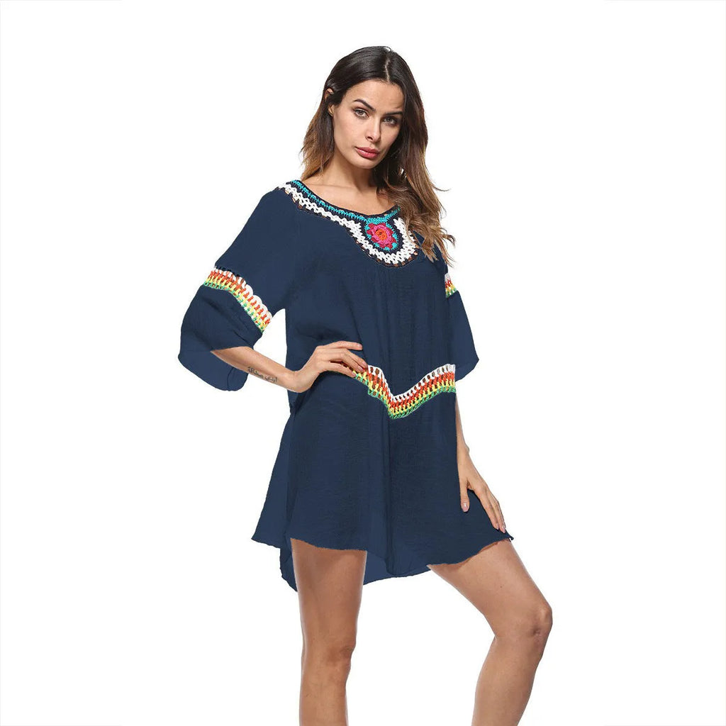 Crocheted ethnic-style white acrylic beach cover-up for women on a mannequin