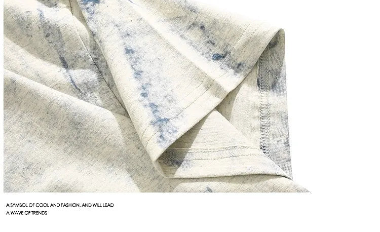 Grey loose fit short sleeve t-shirt with a full body tie dye pattern, showing round neck collar.