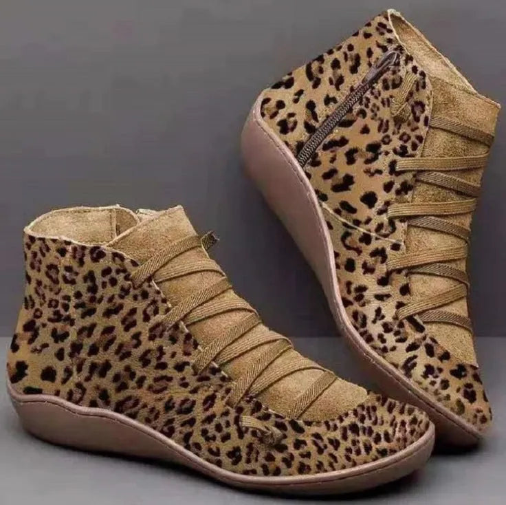 Women's casual ankle booties with flat wedge heel and round toe in various colours on a white background