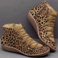 Women's casual ankle booties with flat wedge heel and round toe in various colours on a white background