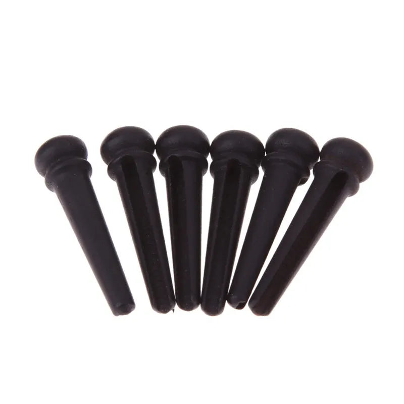 Six matt black ebony guitar string nails for folk acoustic guitars