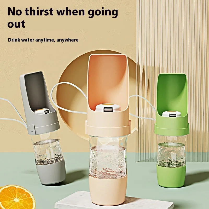 Gray 2-in-1 travel dog water bottle and feeder with lanyard, showing folding design and drinking cup.