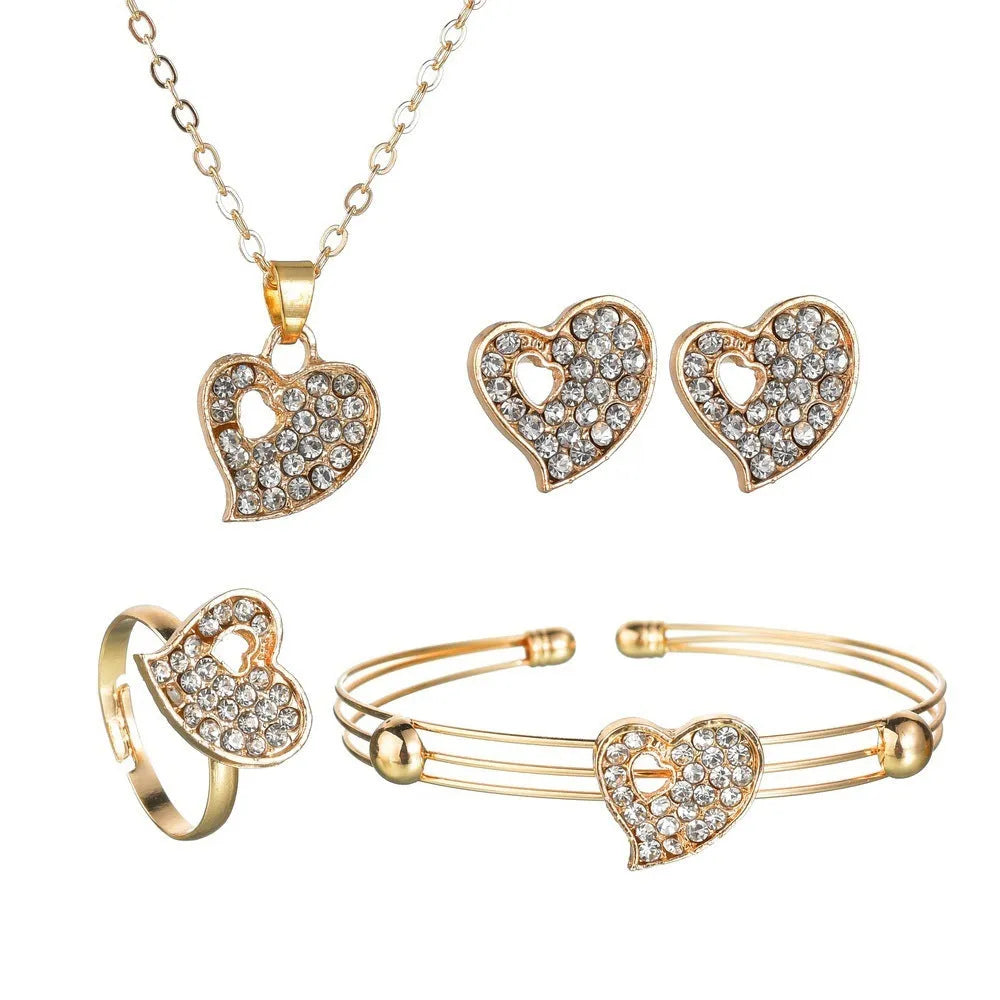 Gold-colour alloy jewellery set with earrings, pendant, and bracelet featuring love and bell patterns
