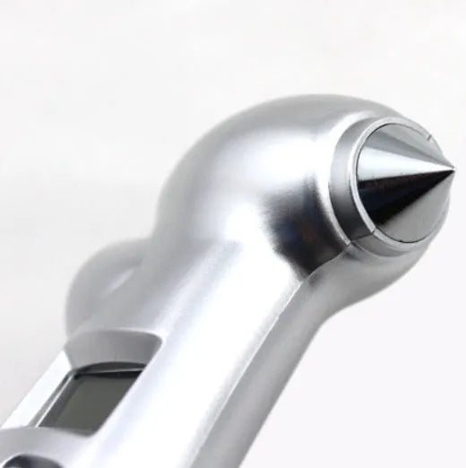 Silver four-in-one digital tire pressure gauge with display, stainless steel hammer, and emergency light on car seat
