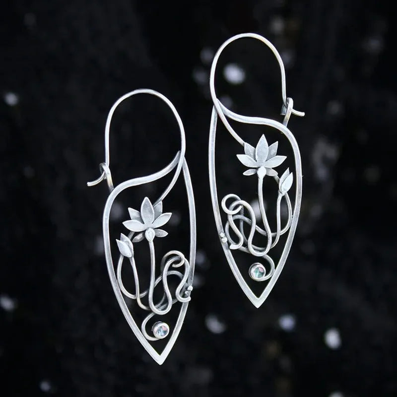 Silver rhinestone earrings with lotus vine design featuring geometric floral shapes and round crystal elements