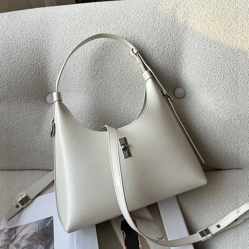 Women's genuine leather dumpling-shaped crossbody shoulder bag in apricot colour with a sandwich pocket.