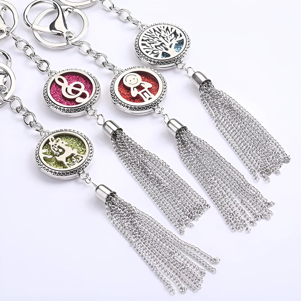 Alloy tassel car pendant with chain hanging, showing 12mm diameter fragrance compartment and coloured cotton inserts