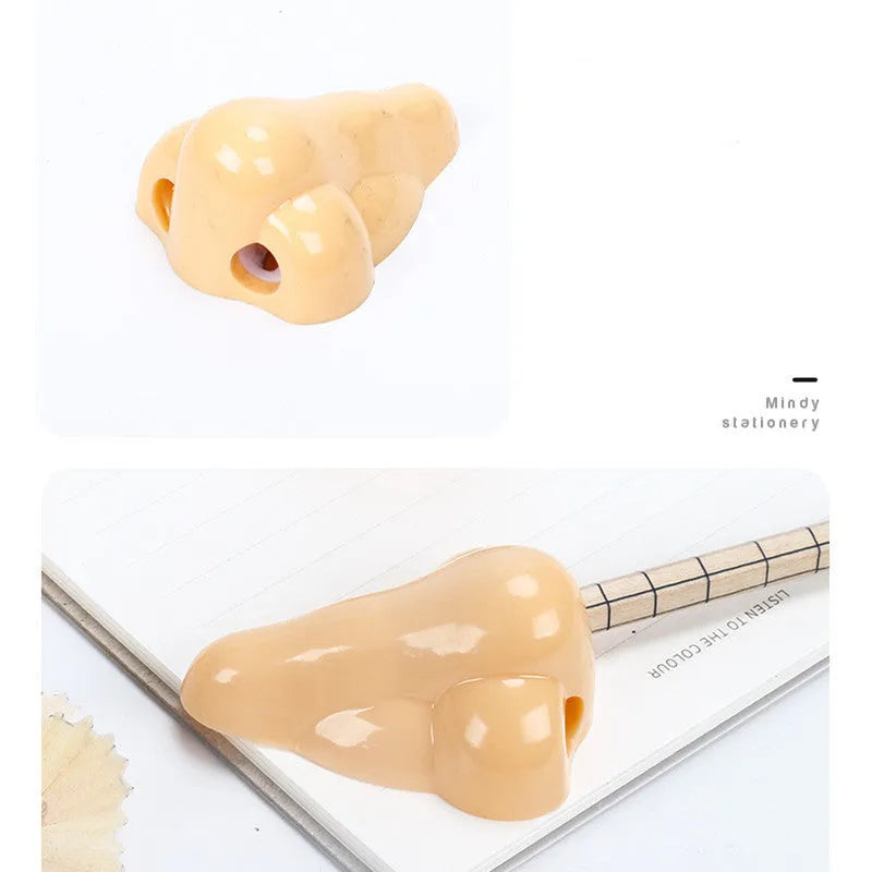 Flesh colour plastic manual pencil sharpener with geometry shape measuring 58x45x30mm for student stationery