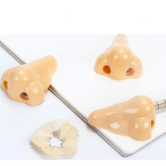 Flesh colour plastic manual pencil sharpener with geometry shape measuring 58x45x30mm for student stationery