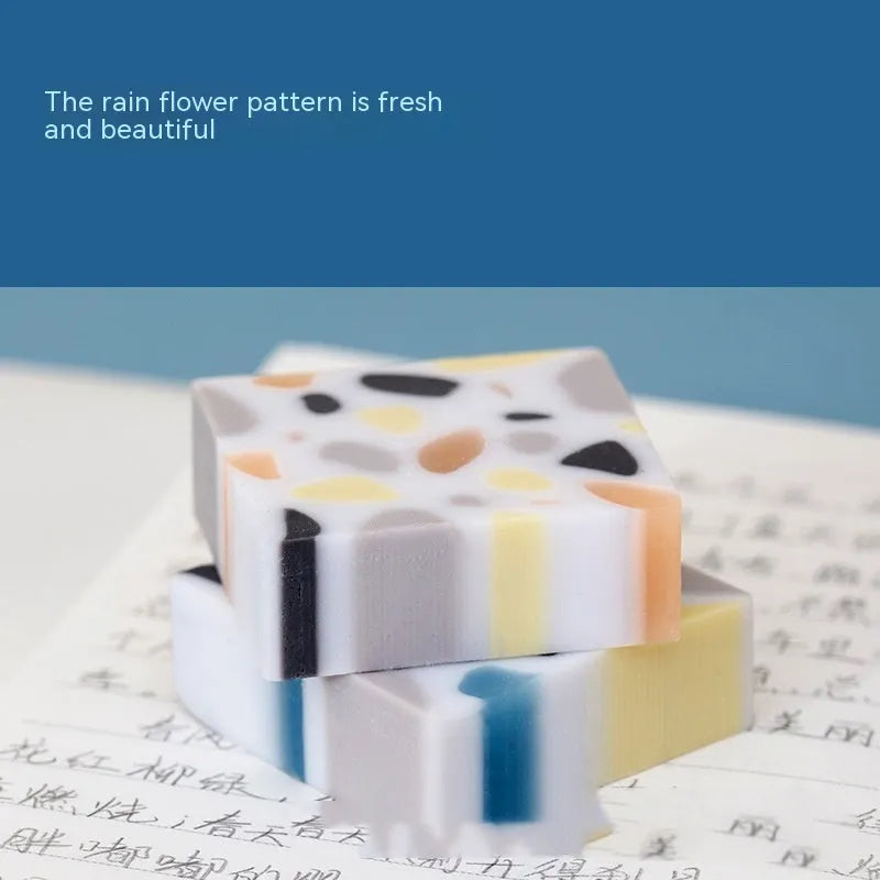 White rubber brick-format eraser for students on a plain background