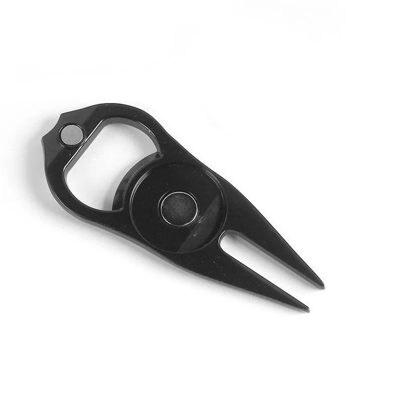 Black zinc alloy golf ball yoke and bottle opener tool with 25mm coin on putting green
