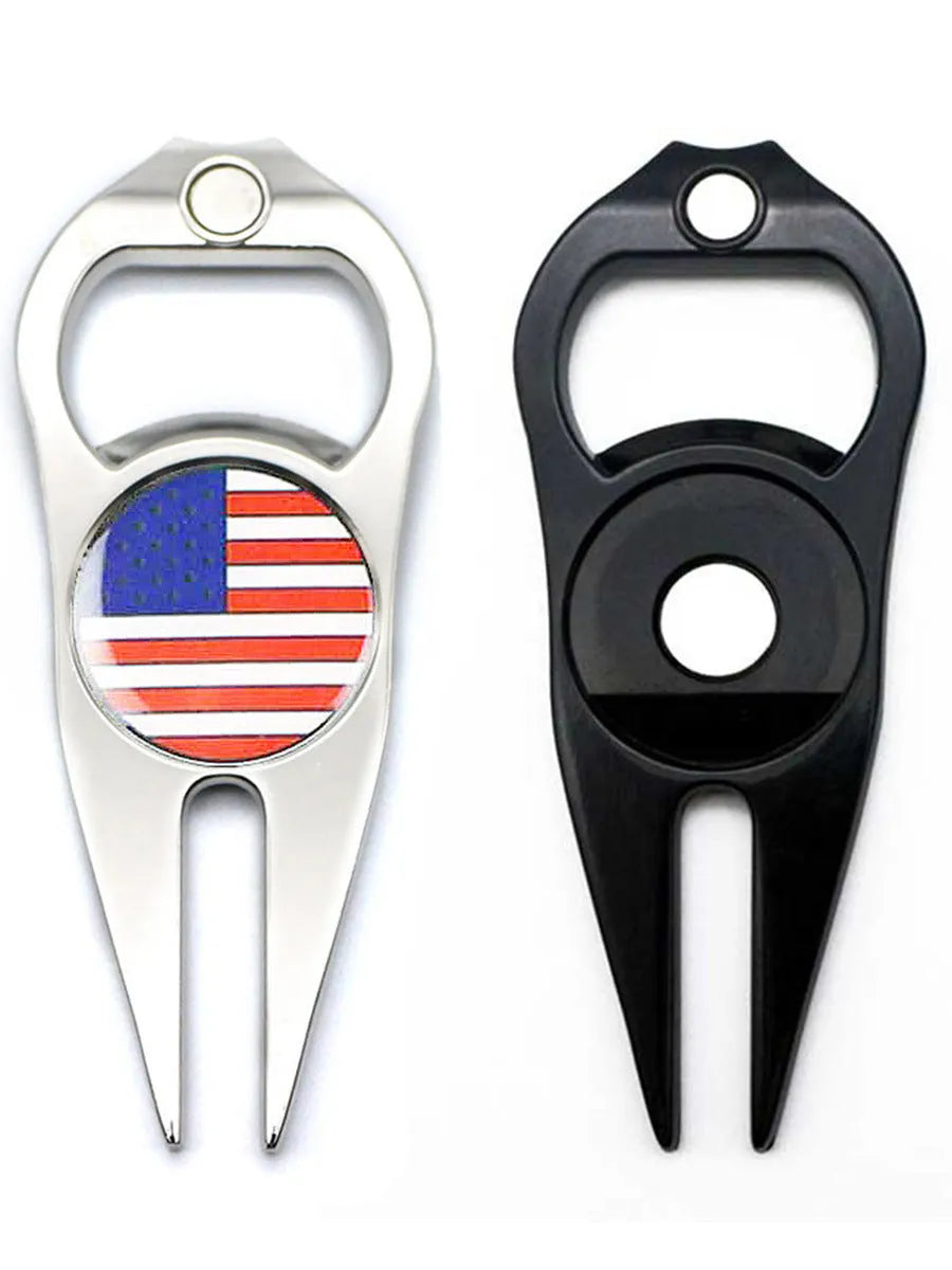 Black zinc alloy golf ball yoke and bottle opener tool with 25mm coin on putting green