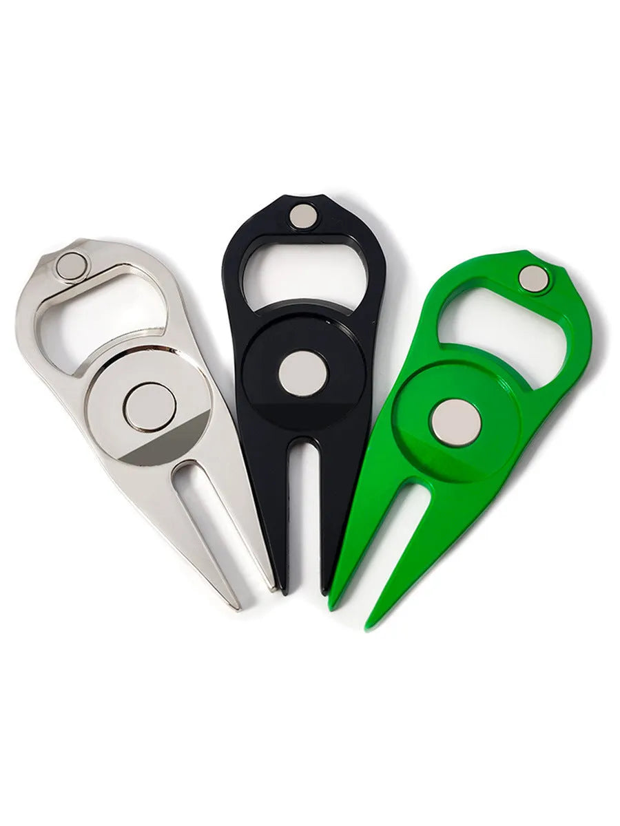 Black zinc alloy golf ball yoke and bottle opener tool with 25mm coin on putting green