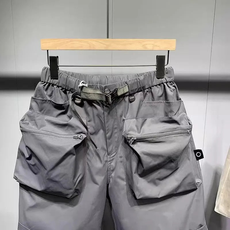 Men's black work shorts with multiple pockets and above-knee length