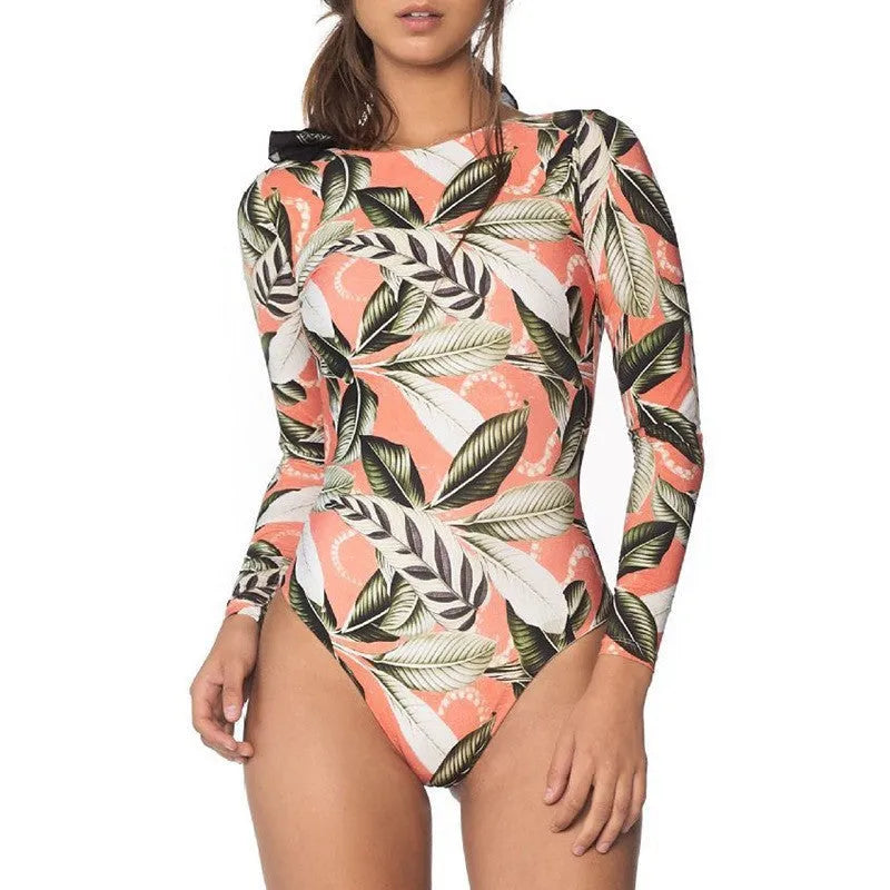 Women's backless one-piece swimsuit with green leaf print pattern on polyester fabric.