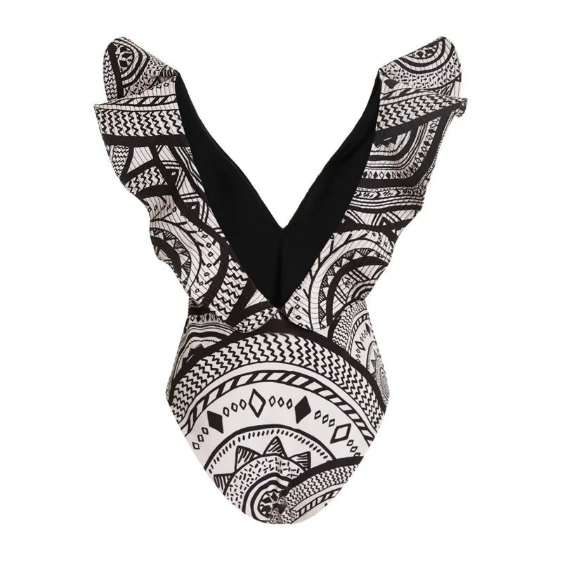 Women's vintage print one-piece swimsuit with deep V-neck and ruffles, plus matching wrap skirt.