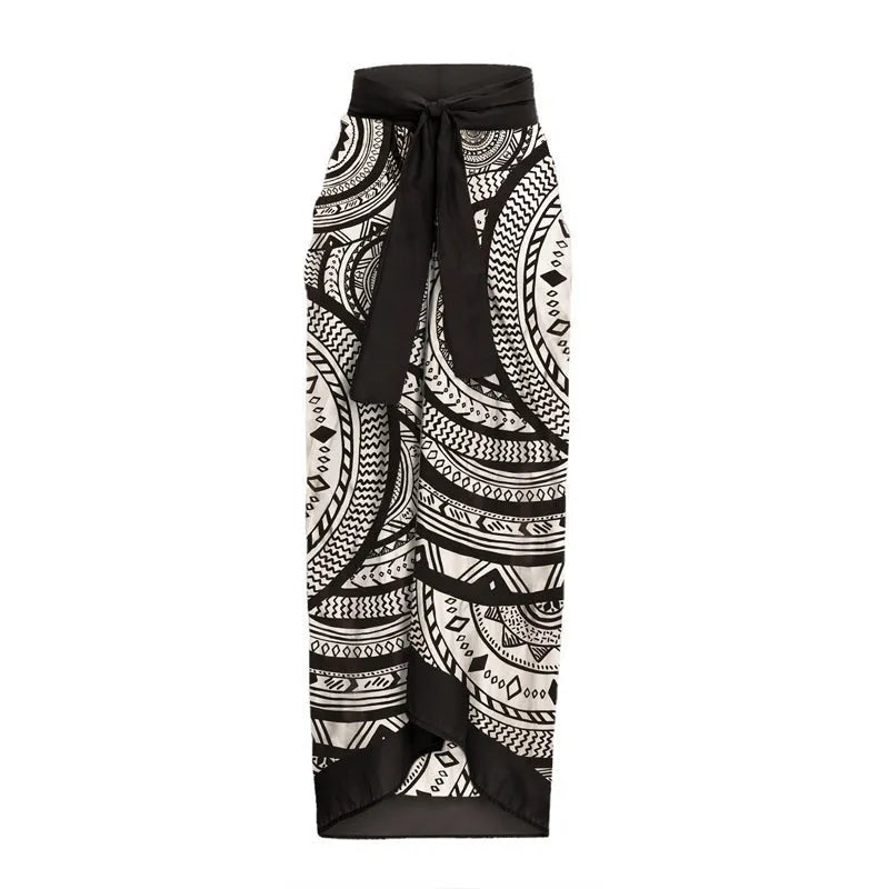 Women's vintage print one-piece swimsuit with deep V-neck and ruffles, plus matching wrap skirt.