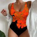Women's one-piece swimsuit with 3D printed pattern in orange red, purple, and sky blue colours