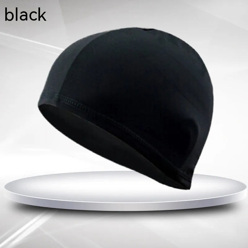 Black polyester fabric swim cap for adults laid flat.