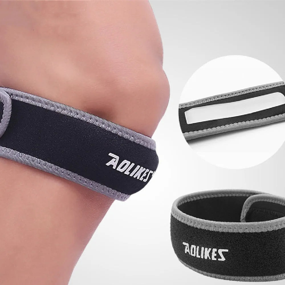 Black and grey edged patella retinaculum knee support for adult sports.