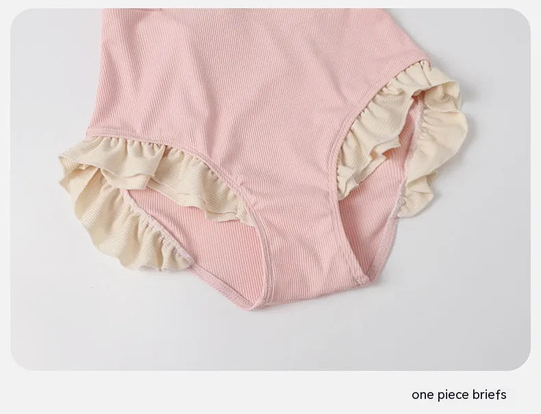 Pink women's Siamese-style one-piece swimsuit on a white background