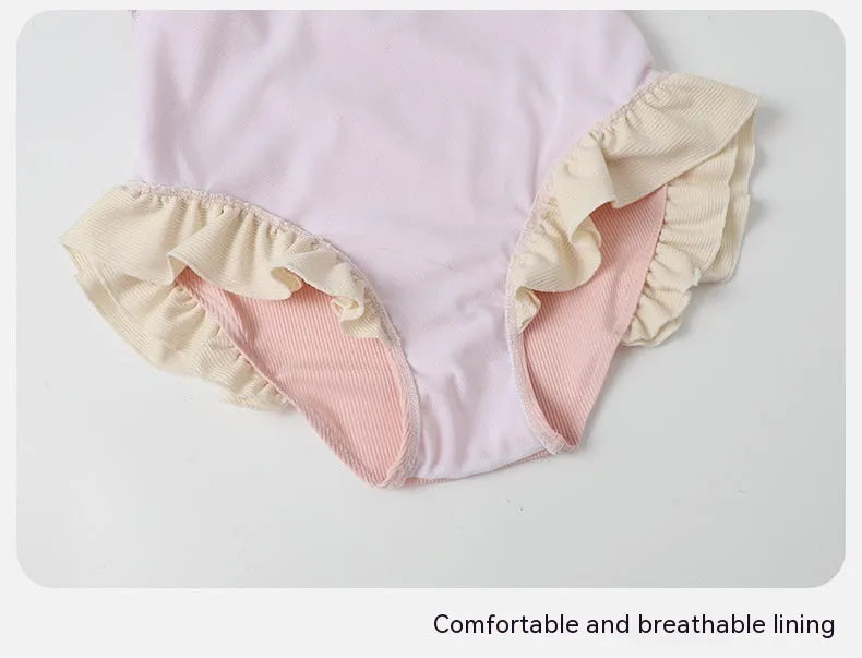 Pink women's Siamese-style one-piece swimsuit on a white background