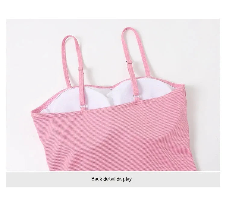 Women's long-sleeve one-piece swimsuit in polyester fabric available in pink or black colours