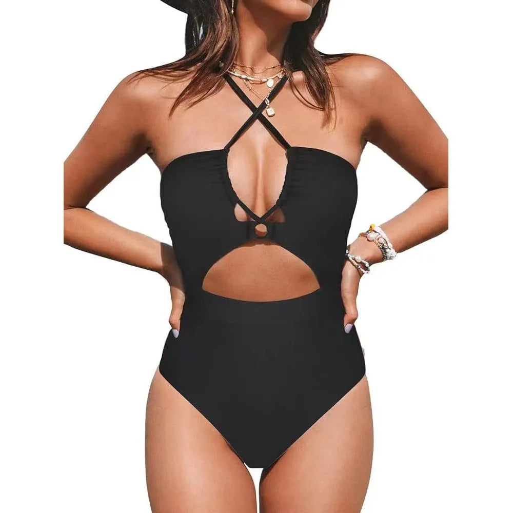 Solid colour women's one-piece swimsuit with cross-back design on mannequin.