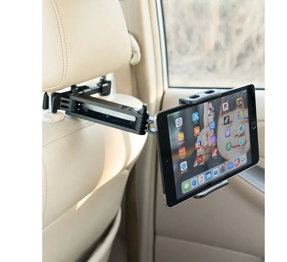 Black universal car phone holder mounted on rear seat base holding a tablet