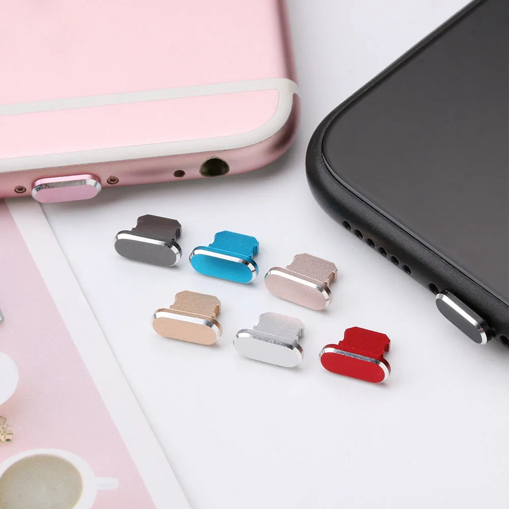 Aluminium alloy dust plug for iPhone charging port in a selection of colours including gold, silver, and rose gold.