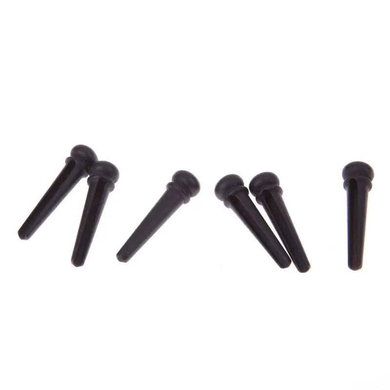 Six matt black ebony guitar string nails for folk acoustic guitars