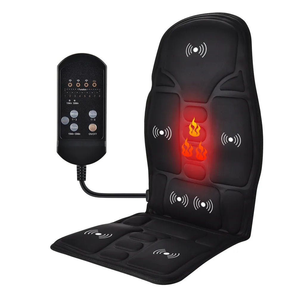 Black electric cervical vertebra massager with wireless remote control on a table.