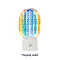 Creative small night lamp with rotating head and dimmable light on a table