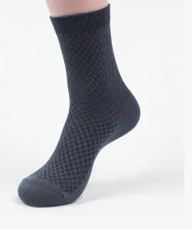 Men's bamboo fibre business socks in small square pattern, shown in classic colours on a grey background.