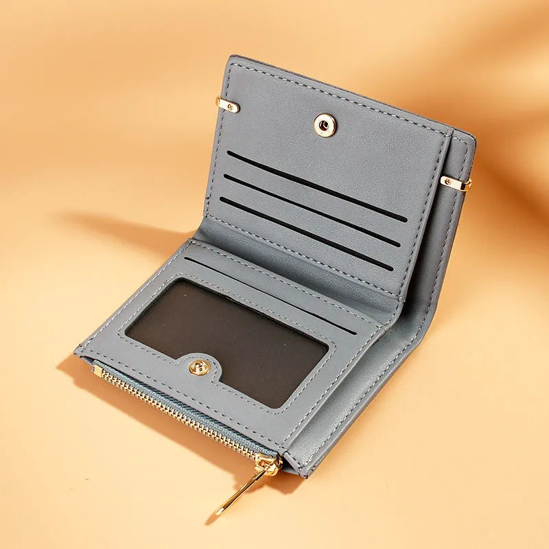 Black PU leather ladies wallet open to show card slots, bill holder, photo slot, and zipper compartment.