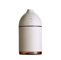 White ultrasonic aromatherapy diffuser with 300ml capacity, USB port, and LED light on wooden surface