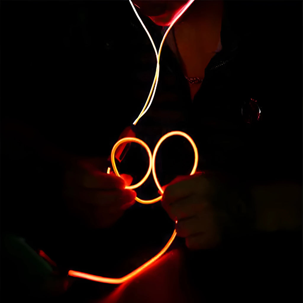Magic Light LED Earphones with illuminated cable and aluminium alloy earpieces in blue, green, or pink.