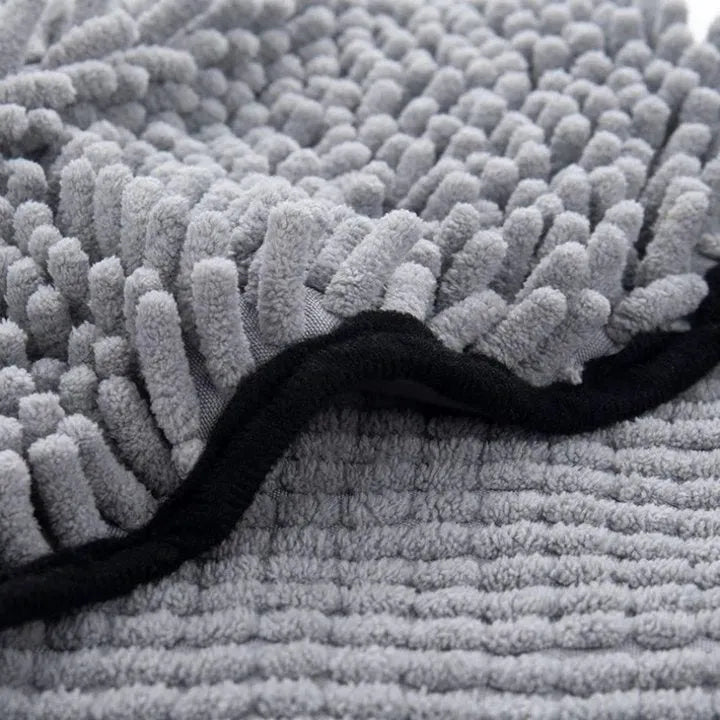 Soft fibre pet bath towel in blue, grey, purple, or red, measuring 62 cm by 23 cm.