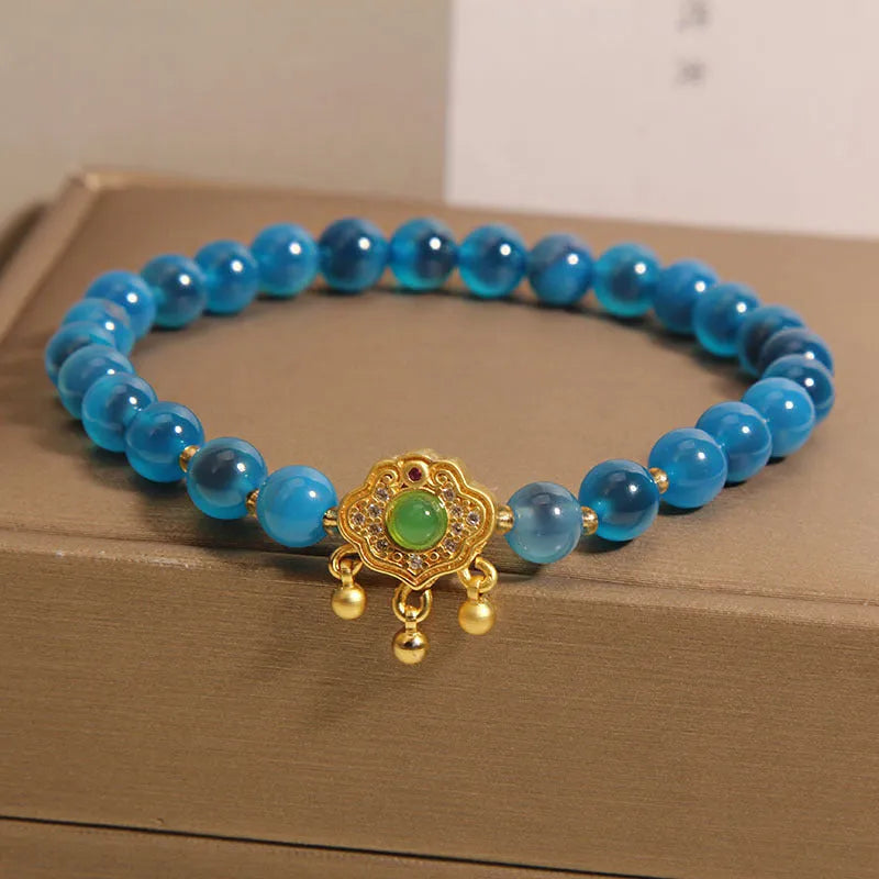 Women's blue agate safety lock pendant bracelet with crystal and rhinestone details