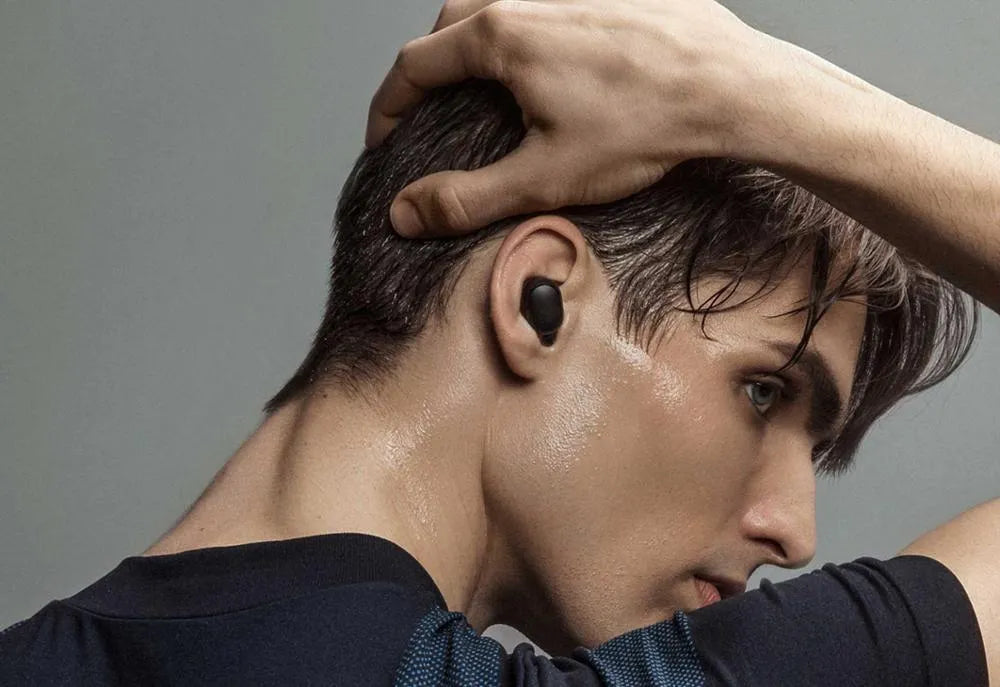 Redmi AirDots black true wireless Bluetooth headphones with charging case.