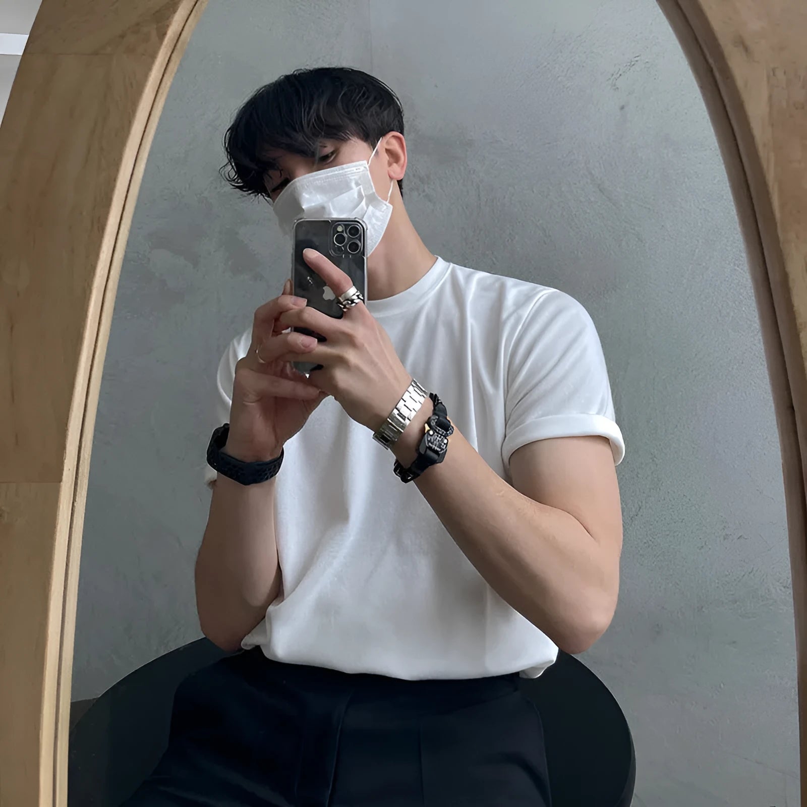 Men's slim fit cotton t-shirt in black, showing round neck and half-sleeve design.