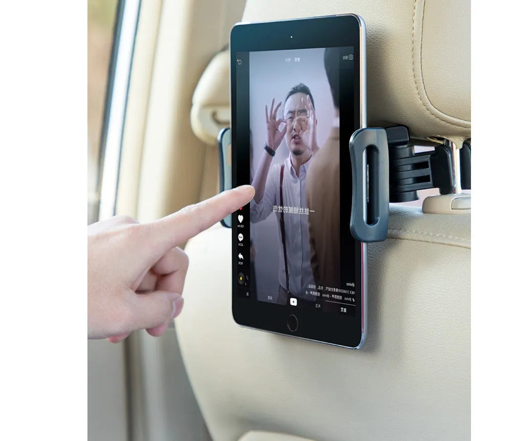 Black universal car phone holder mounted on rear seat base holding a tablet