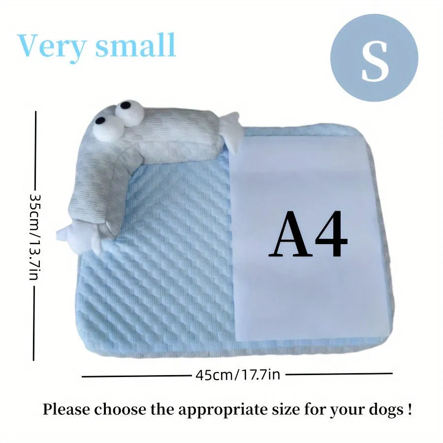 Blue and yellow big-eyed monster design pet bed cushion for dogs and cats on a wooden floor.