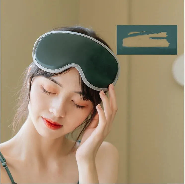Green portable eye SPA mask showing suede shell and contoured shape for steam heat and vibration massage.