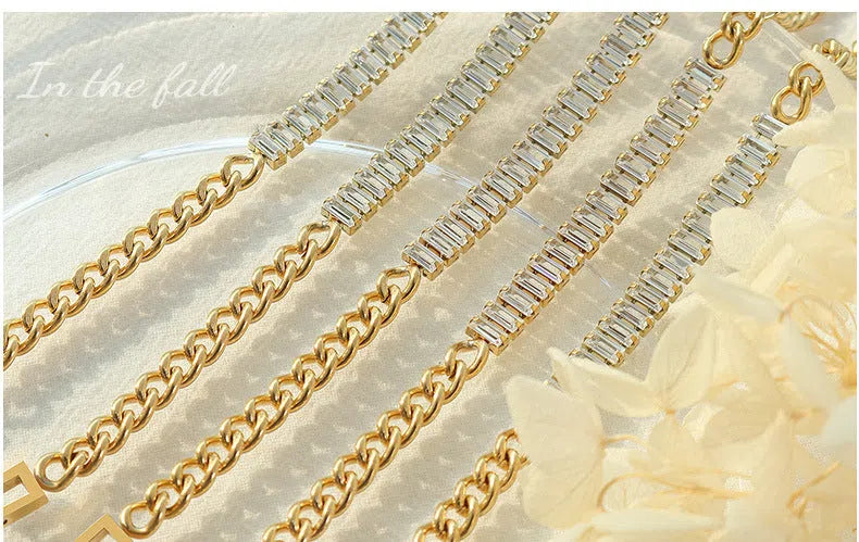 Gold titanium steel geometric matte finish unisex bracelet on flat surface