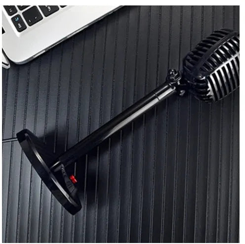 Black USB computer microphone on an adjustable ABS stand with a silicone foot pad.