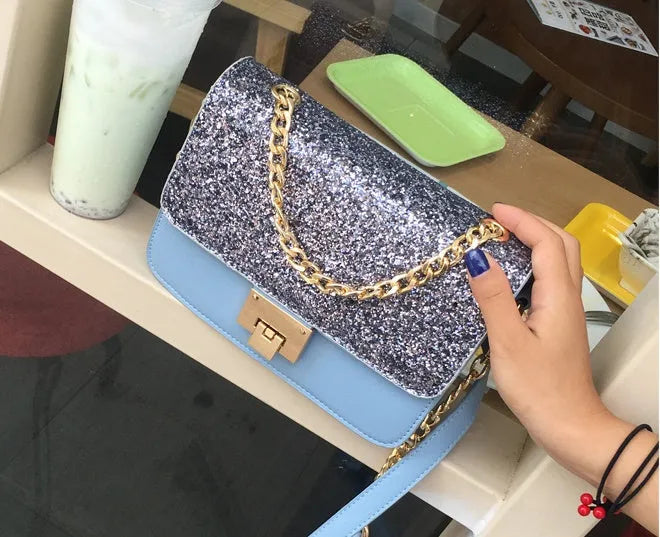 Women's small square sequined PU handbag with lock closure and adjustable shoulder strap in pink, wathet, and black colours 22x16x9cm
